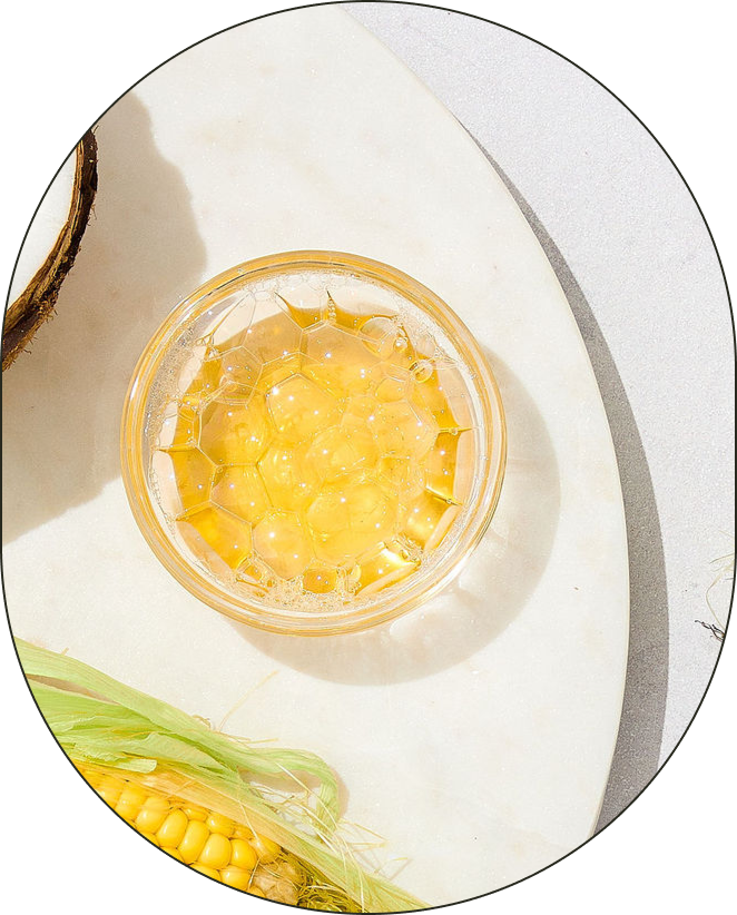 A bowl of Decyl Glucoside, positioned against a neutral-grey background. - Card 1