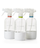 The Glass Bottles Essentials Pack, featuring Bathroom, All-Purpose, and Streak-Free versions of Branch Basics refillable Glass bottles, displayed on a transparent background.