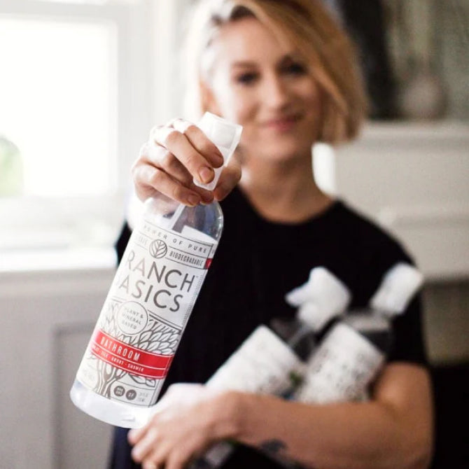 Customer holding Branch Basics cleaning products