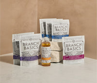 The Full Restock Bundle, featuring a bottle of Branch Basics Concentrate, Oxygen Boost, Laundry Detergent, and Dishwasher Tablets displayed against a neutral background. - Thumbnail View 1
