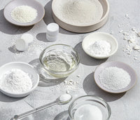 An array of glass and ceramic bowls, each containing an ingredient included in Branch Basics Dishwasher Tablets. - Thumbnail View 5
