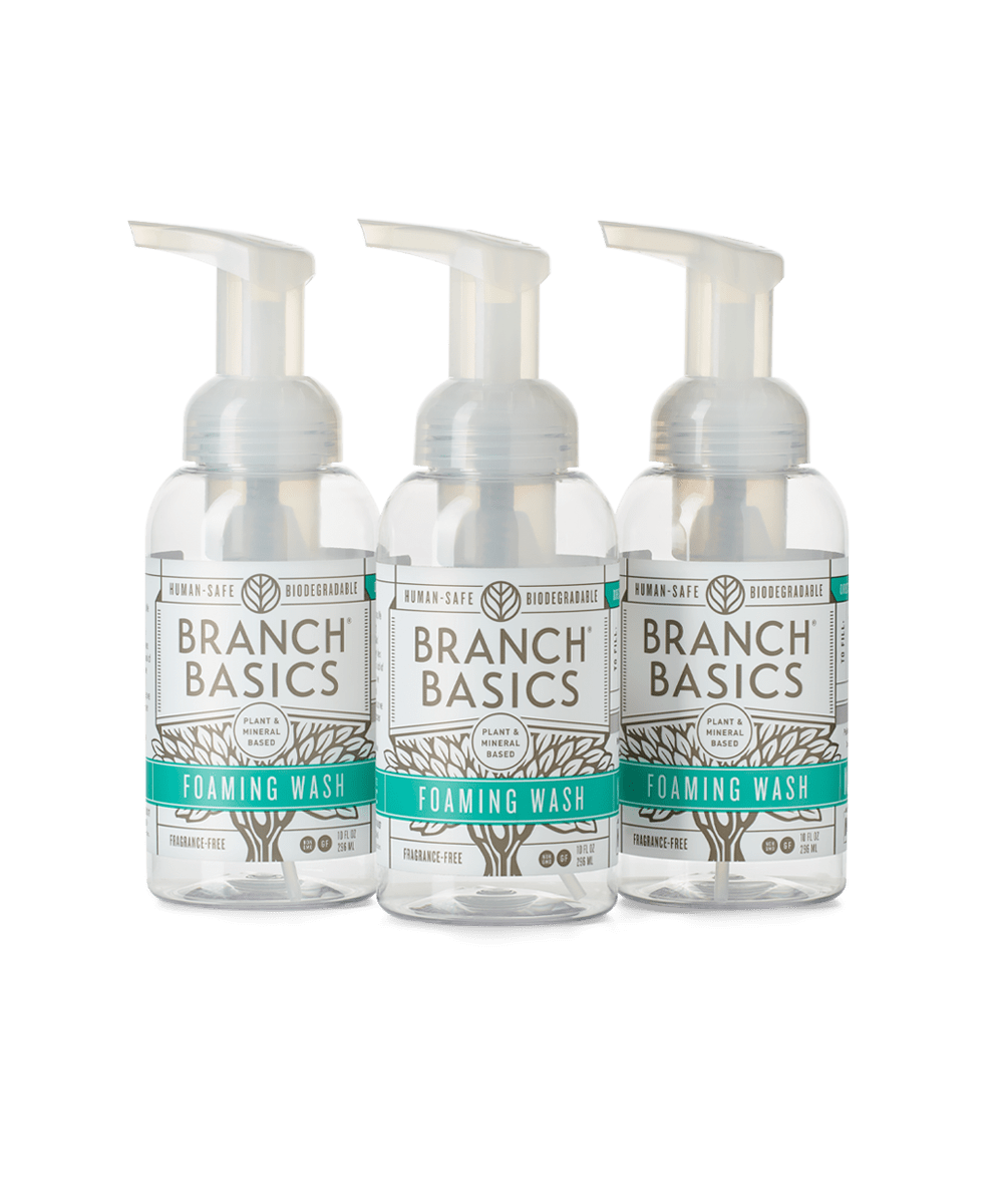 A trio of refillable Plastic Foaming Wash Bottles, displayed on a transparent background. - View 1
