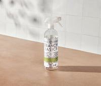 A refillable Plastic All-Purpose bottle, used to dilute and dispense Branch Basics Concentrate with water, displayed on a neutral surface and white tiled background. - Thumbnail View 2

