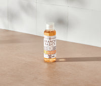 A mini-bottle of the Branch Basics Concentrate, displayed on a neutral surface and white tiled background. - Thumbnail View 2
