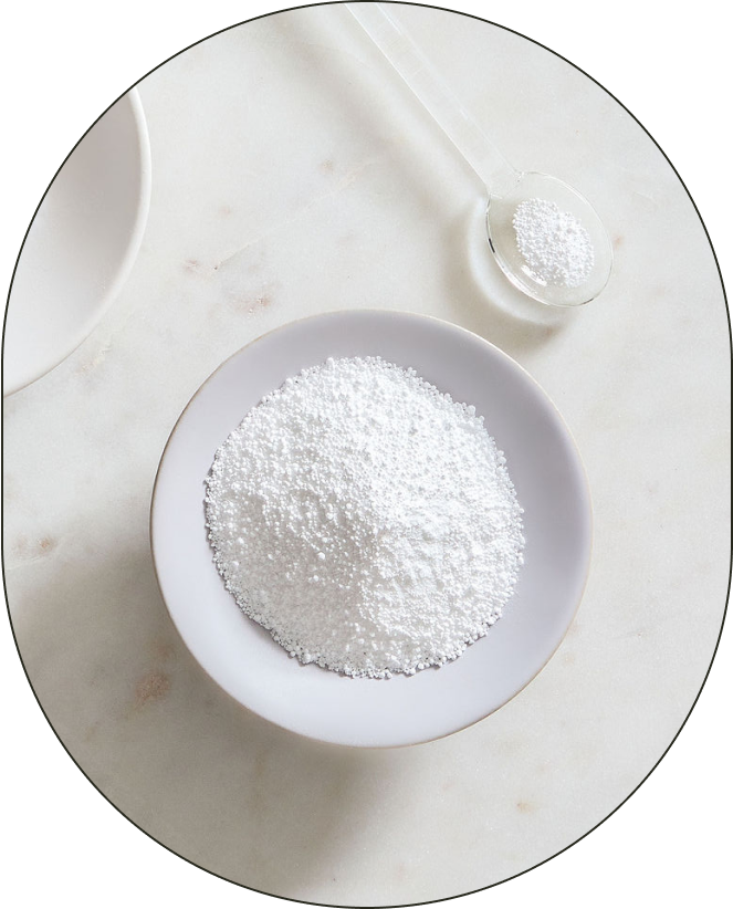 A bowl and small spoonful of Sodium Bicarbonate, positioned against a neutral background. - Card 1