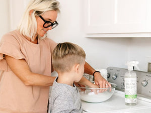 Mother and child treating stains