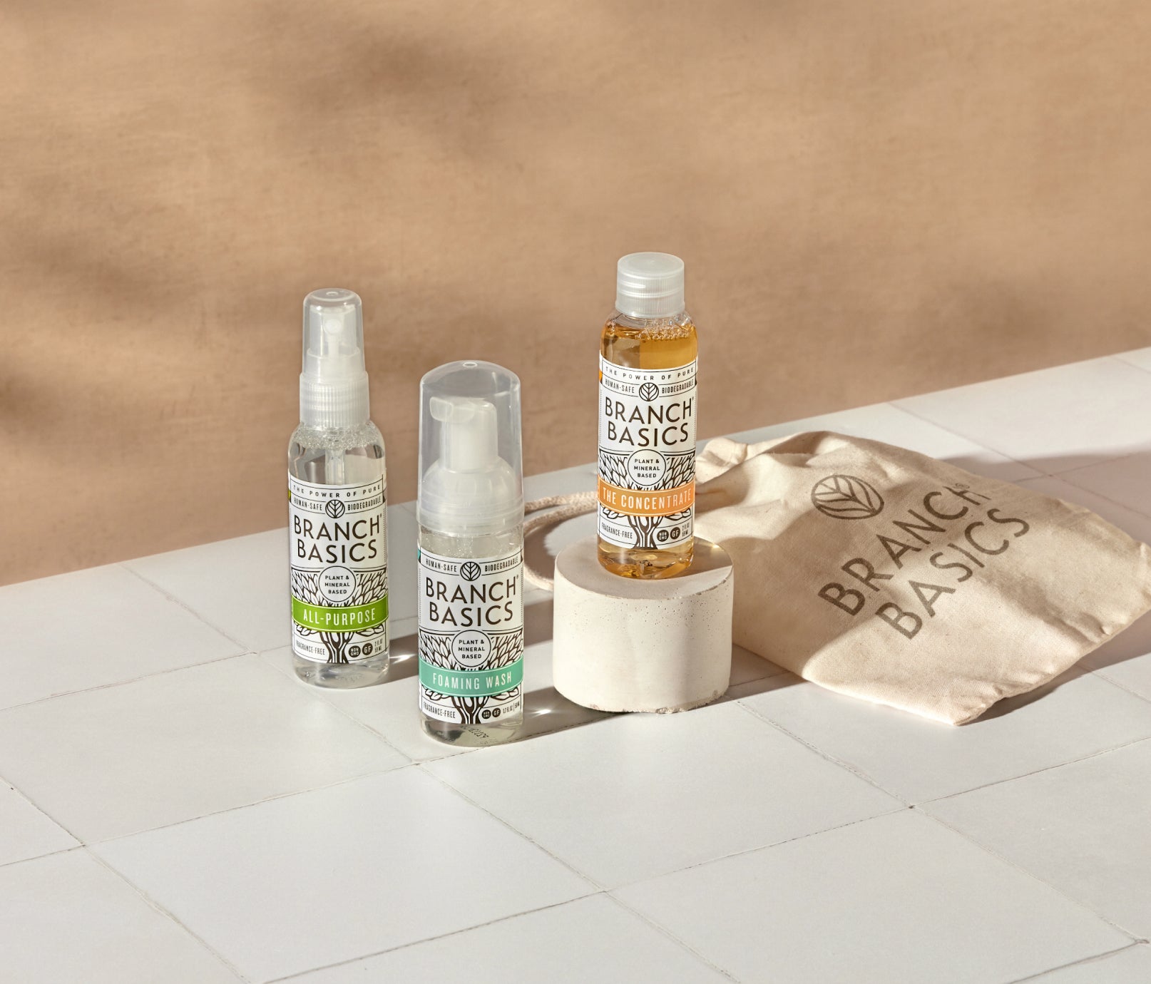 The Travel Kit, featuring mini-versions of the Branch Basics Concentrate, All-Purpose spray, and Foaming Wash pump, displayed on a neutral background. - View 2
