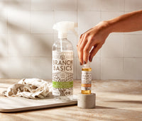 The Trial Kit featuring a refillable Plastic bottle and a mini-bottle of Branch Basics Concentrate, displayed against a neutral tile background. - Thumbnail View 2
