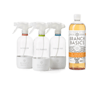 The Cleaning Essentials Kit featuring refillable Glass bottles, displayed against a transparent background. - Thumbnail View 2
