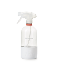 A refillable Glass Bathroom bottle, used to dilute and dispense Branch Basics Concentrate with water, displayed on a transparent background. - Thumbnail View 1
