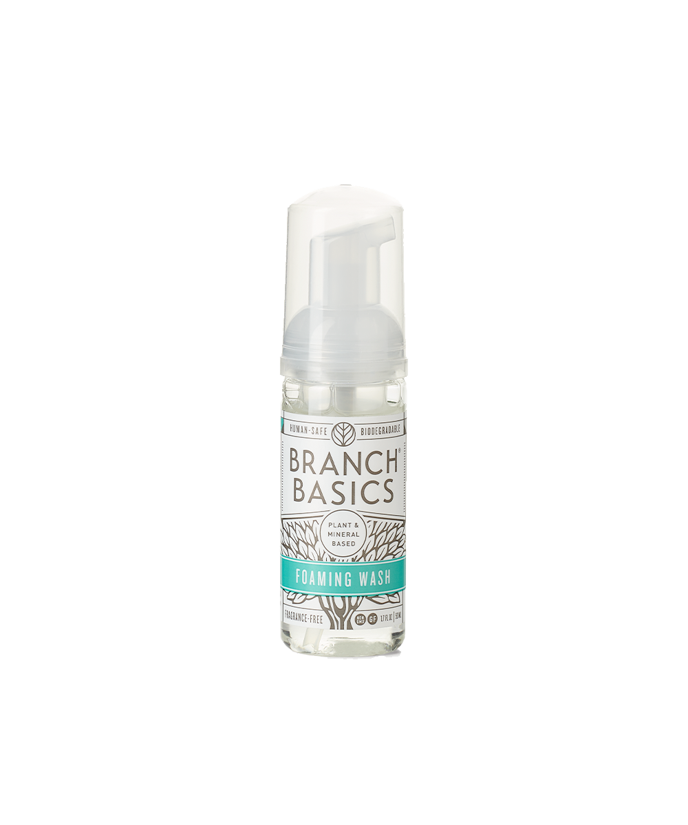 A mini-bottle of the Branch Basics Foaming Wash dispenser, displayed on a transparent background. - View 1
