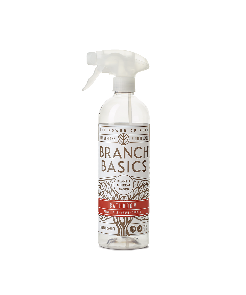 A refillable Plastic Bathroom bottle, used to dilute and dispense Branch Basics Concentrate with water, displayed on a transparent background. - View 1
