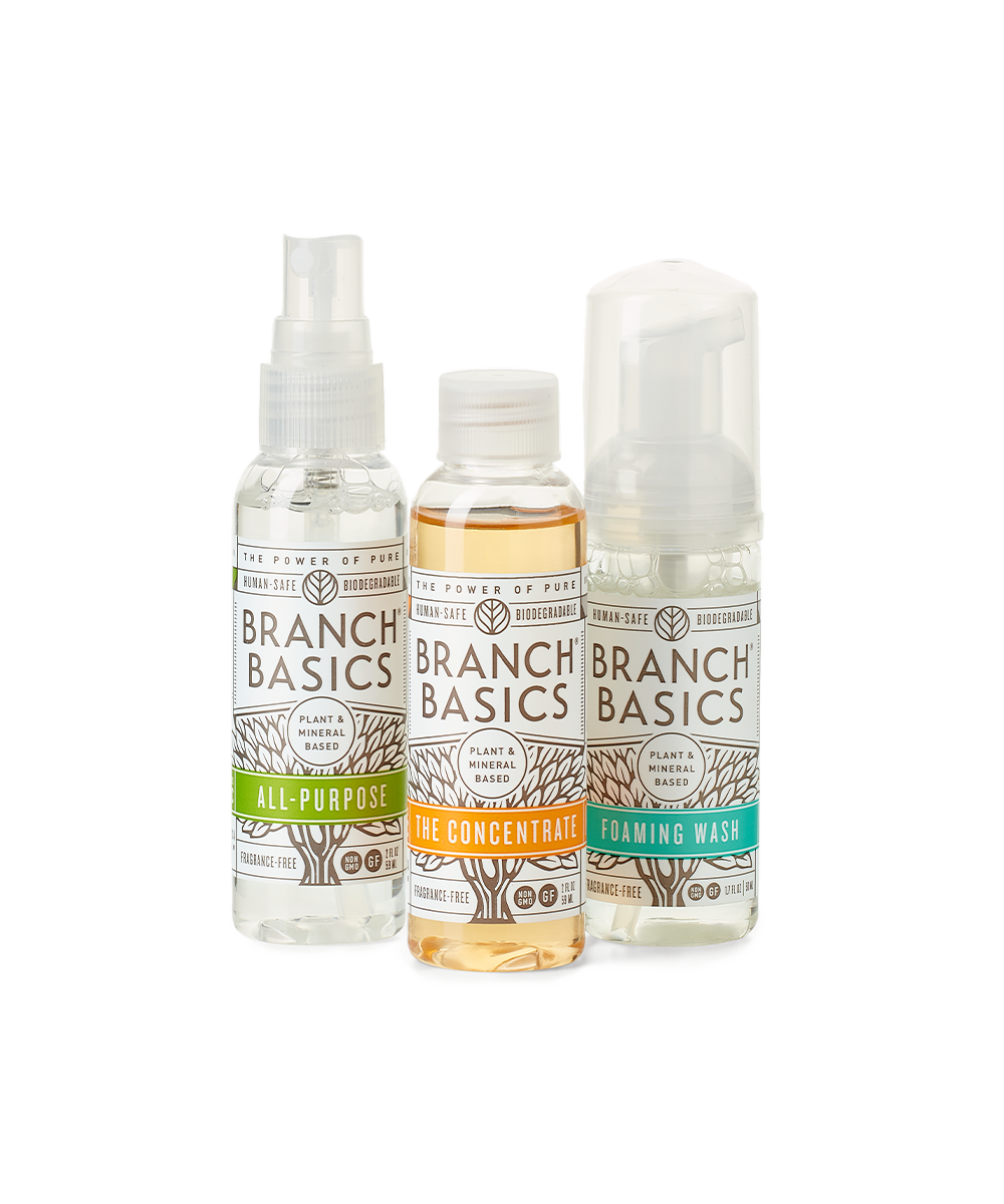 The Travel Kit, featuring mini-versions of the Branch Basics Concentrate, All-Purpose spray, and Foaming Wash pump, displayed against a transparent background. - View 1
