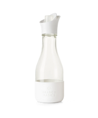 A refillable Glass Laundry bottle, used to dilute and dispense Branch Basics Concentrate with water, displayed on a transparent background. - Thumbnail View 1
